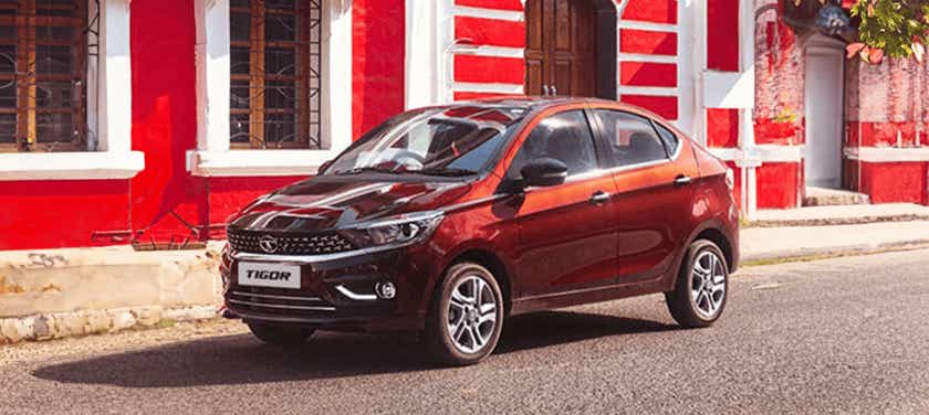 front three-quarter view of a Supernova Copper Tata Tigor
