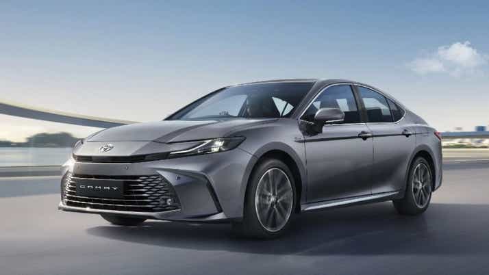 front three-quarter view of a Cement Grey Toyota Camry