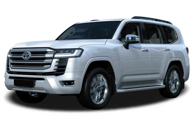 front three-quarter view of a Precious White Pearl Toyota Land Cruiser 300