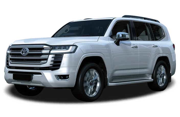 front three-quarter view of a Precious White Pearl Toyota Land Cruiser 300