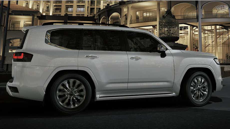 side view of a Precious White Pearl Toyota Land Cruiser 300