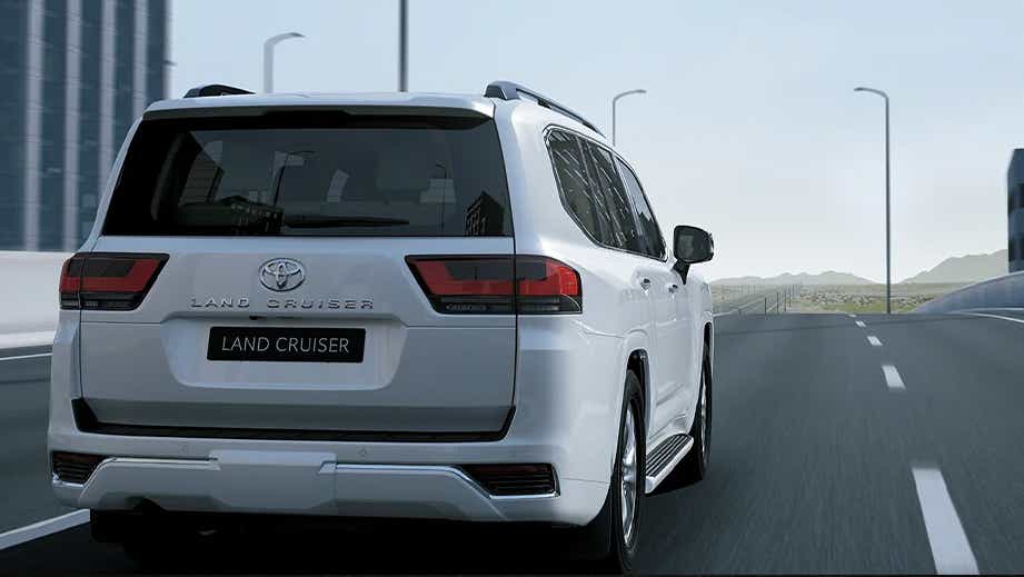 rear view of a Precious White Pearl Toyota Land Cruiser 300
