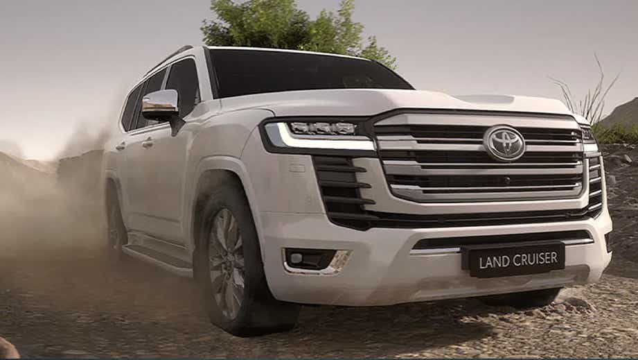 front view of a Precious White Pearl Toyota Land Cruiser 300