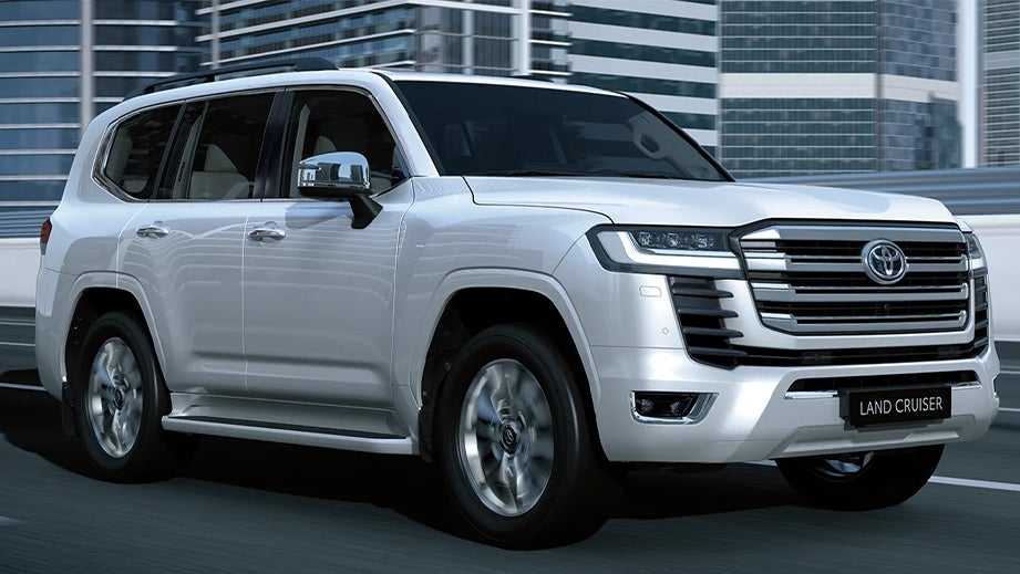 front three-quarter view of a Precious White Pearl Toyota Land Cruiser 300