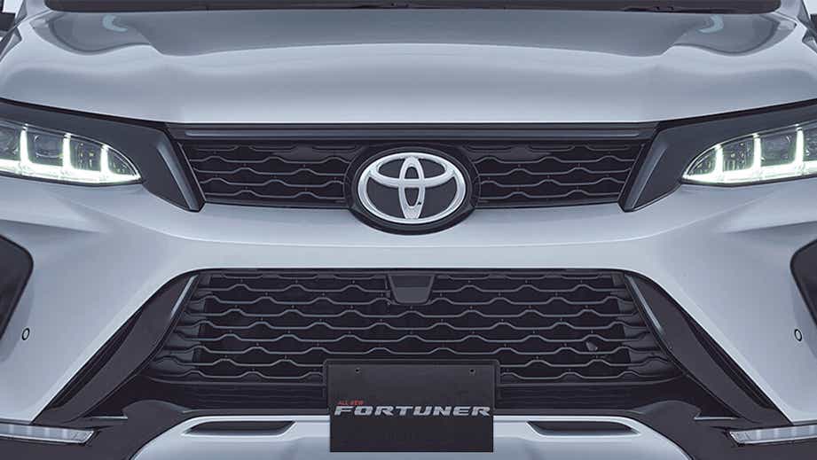 Front grille close-up of a Platinum White Pearl Toyota Fortuner Legender