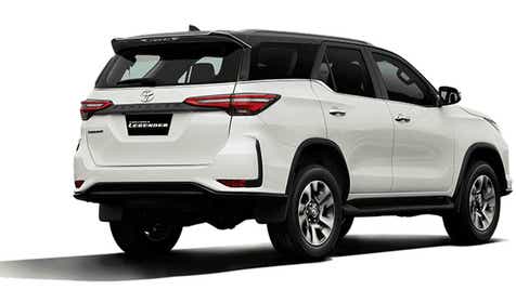 rear three-quarter of a Platinum White Pearl Toyota Fortuner Legender
