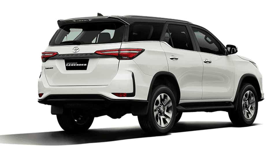 rear three-quarter of a Platinum White Pearl Toyota Fortuner Legender