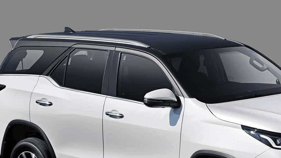 side view of a Platinum White Pearl Toyota Fortuner Legender