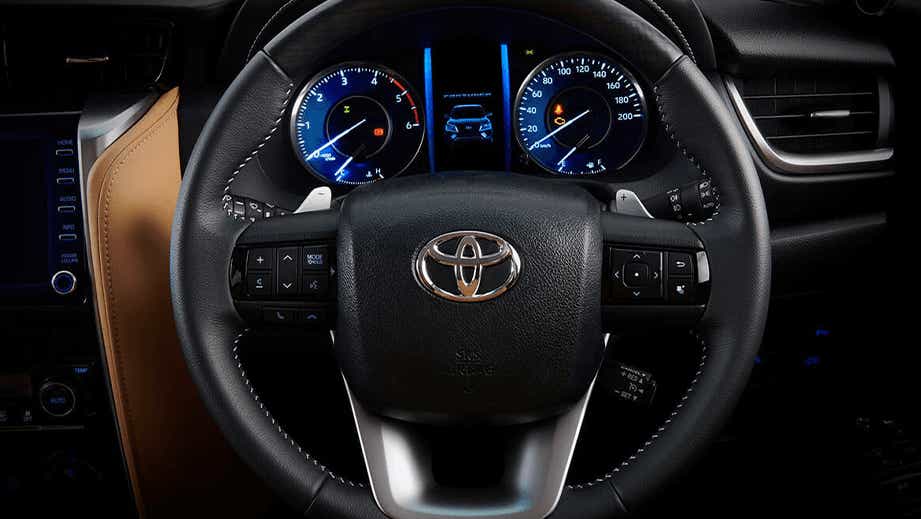 Interior dashboard and steering wheel of a Toyota Fortuner
