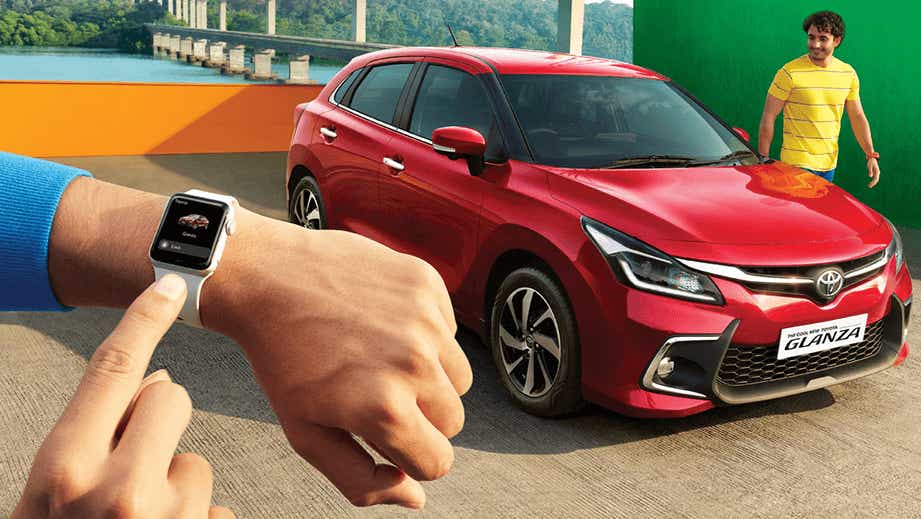 front three-quarter view of a Sportin Red Toyota Glanza