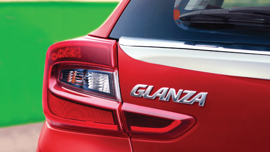 Rear tail light and badge of a Sportin Red Toyota Glanza