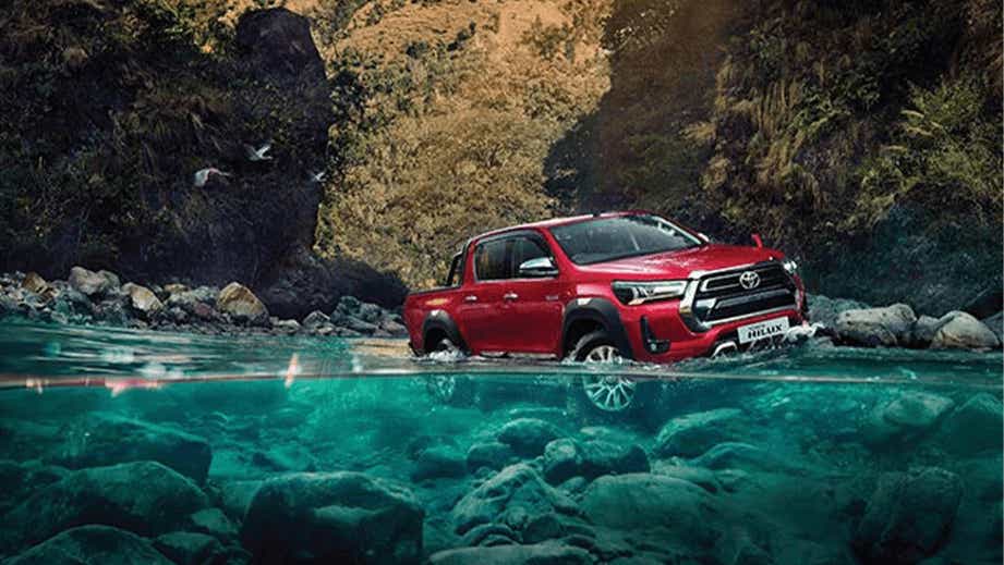 Front three-quarter view of a Emotional Red Toyota Hilux