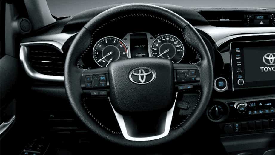 Interior dashboard and steering wheel of a Toyota Hilux