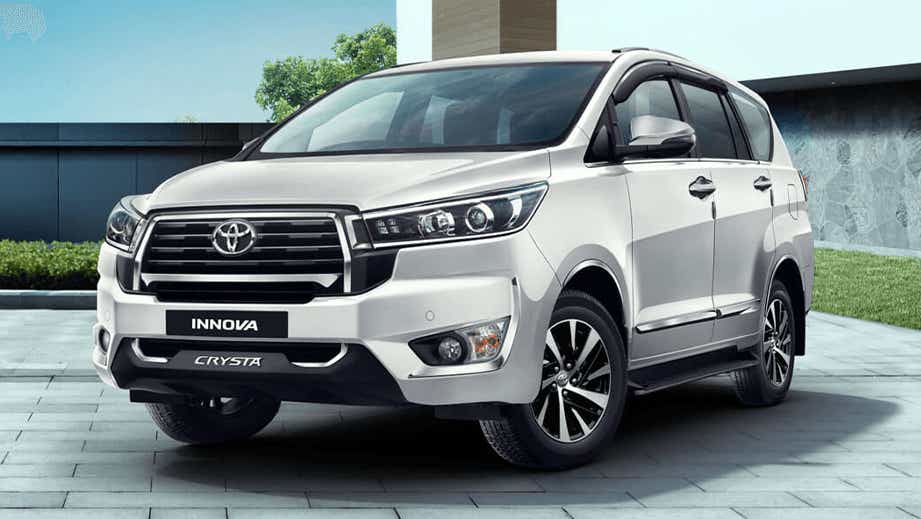 front three-quarter view of a Platinum White Pearl Toyota Innova Crysta