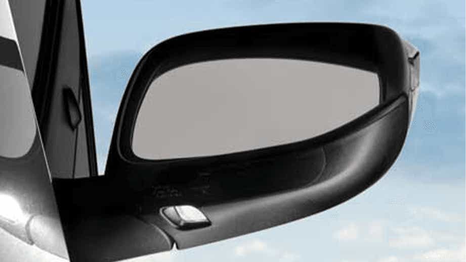 side mirror close-up of a Toyota Innova Crysta