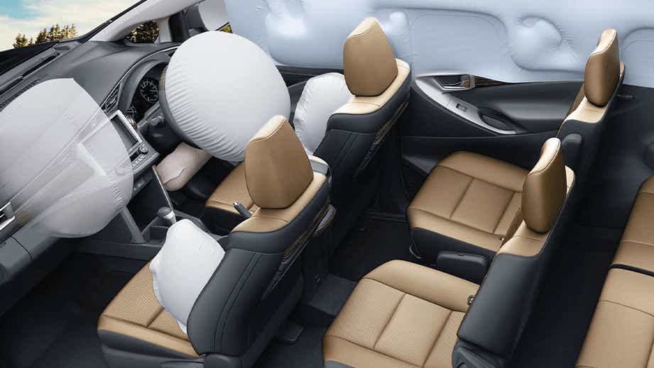 interior view of a Toyota Innova Crysta with deployed airbags