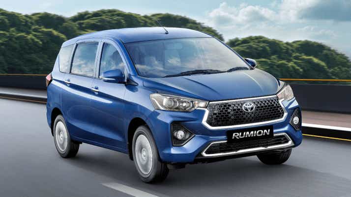 front three-quarter view of a Spunky Blue Toyota Rumion