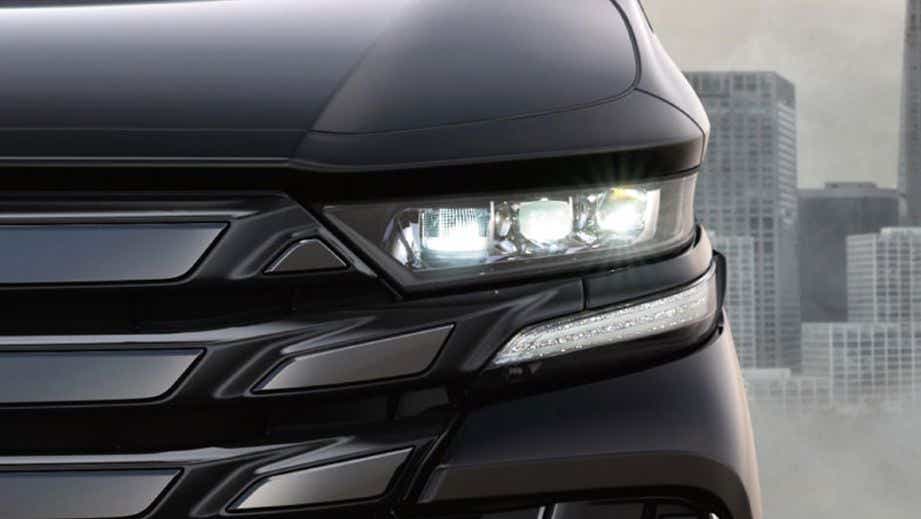 Headlight close-up of a Toyota Vellfire