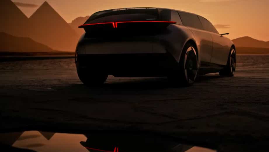 Rear view of a Beige Tata Avinya