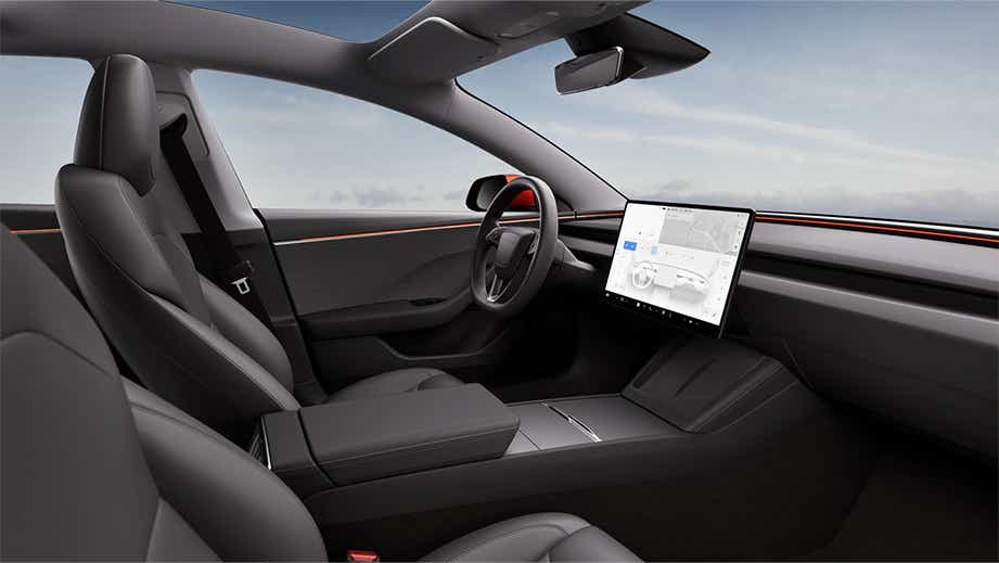 Interior dashboard view of a Black Tesla Model 3