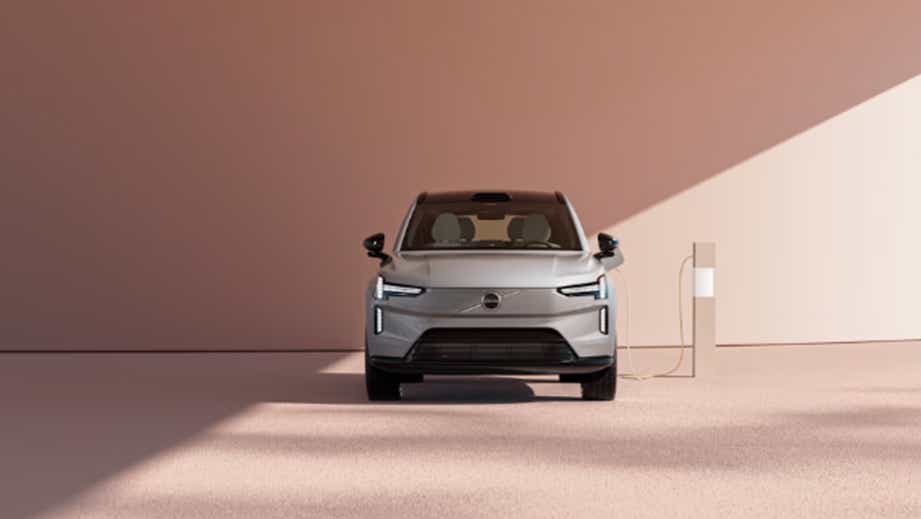 Front view of a Silver Volvo EX90 at a charging station
