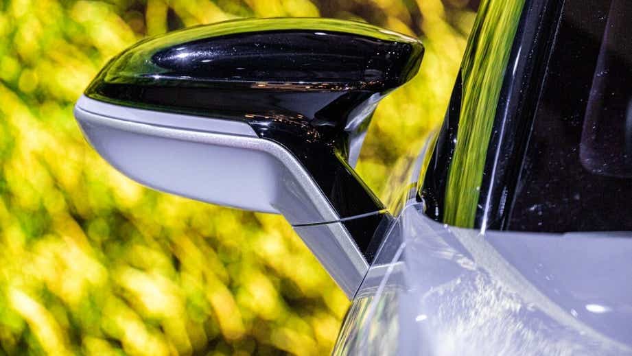 Side mirror close-up of a Vinfast VF7