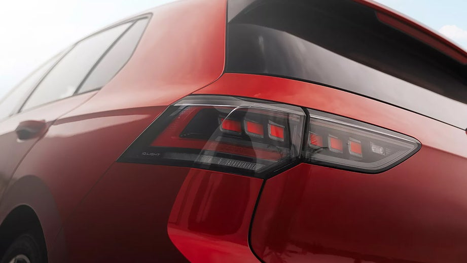 rear quarter view of a Kings Red Metallic Volkswagen Golf GTi