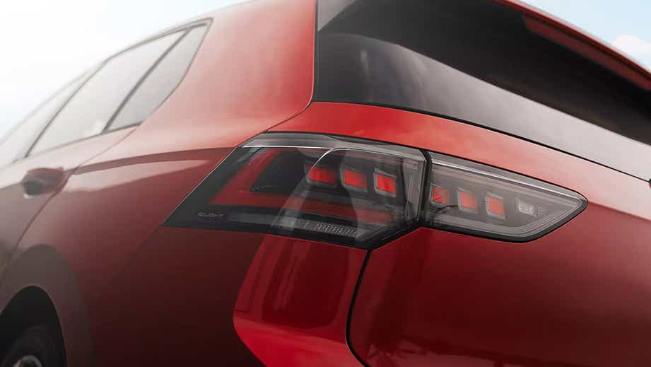 rear quarter view of a Kings Red Metallic Volkswagen Golf GTi