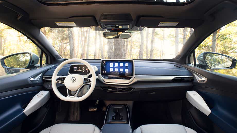 Dashboard and steering wheel view of a Lapiz Blue Volkswagen ID 4