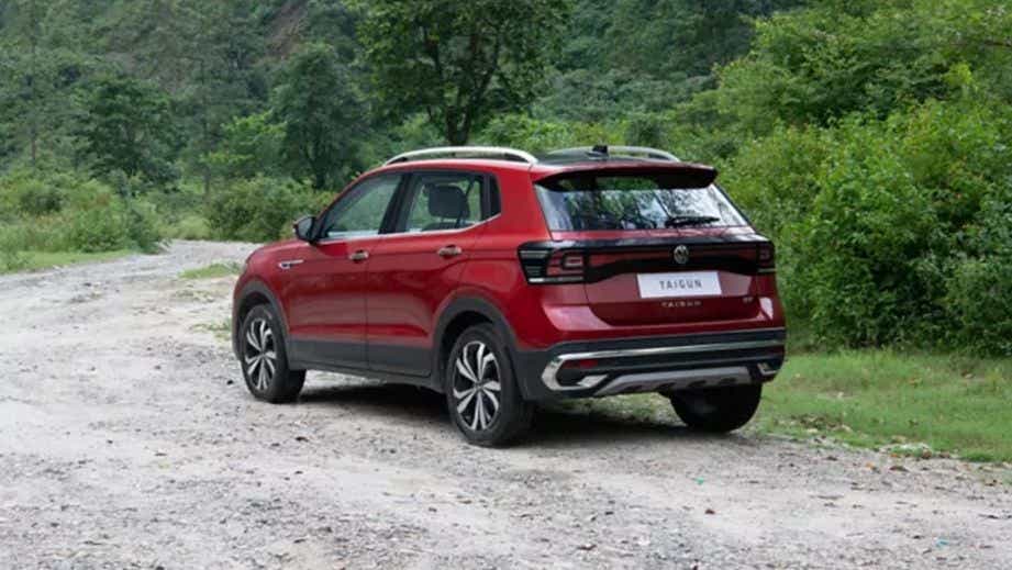 rear three-quarter of a Wild Cherry Red Volkswagen Taigun