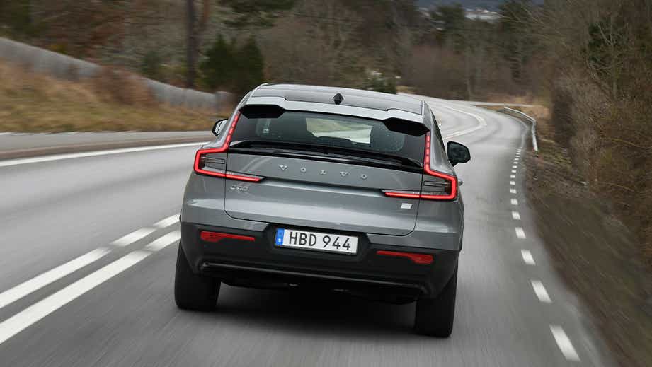 rear view of a Volvo C40 Recharge driving on a curved road