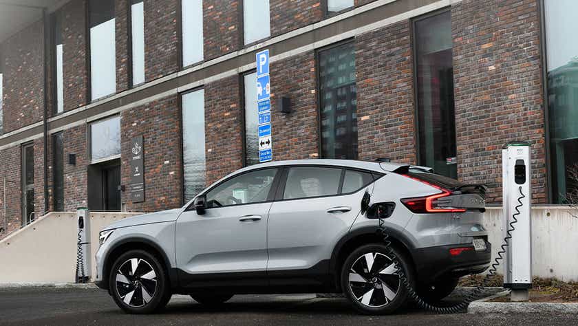 side view of a Volvo C40 Recharge charging at a station