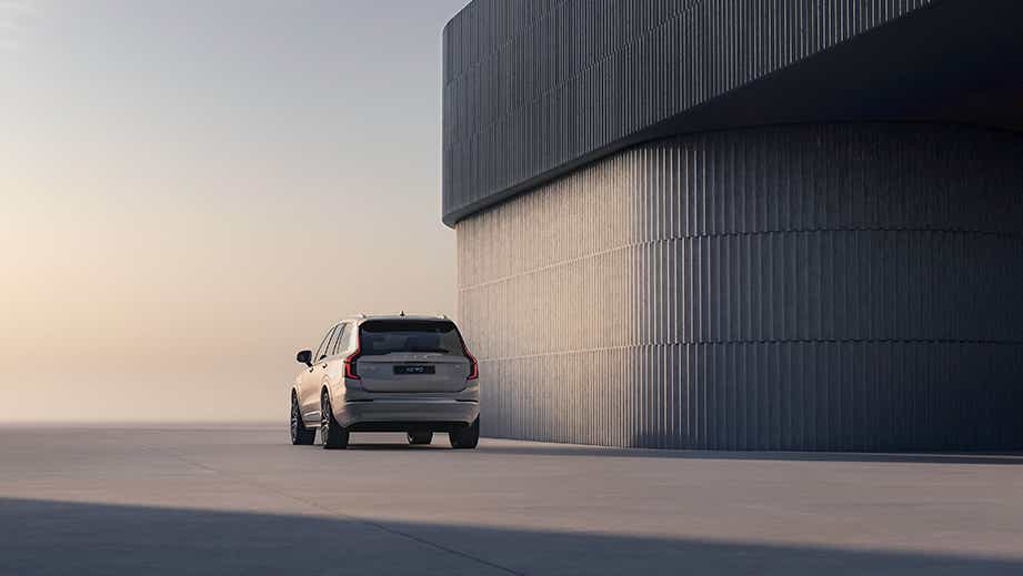 Rear view of a Volvo XC90 beside a modern building