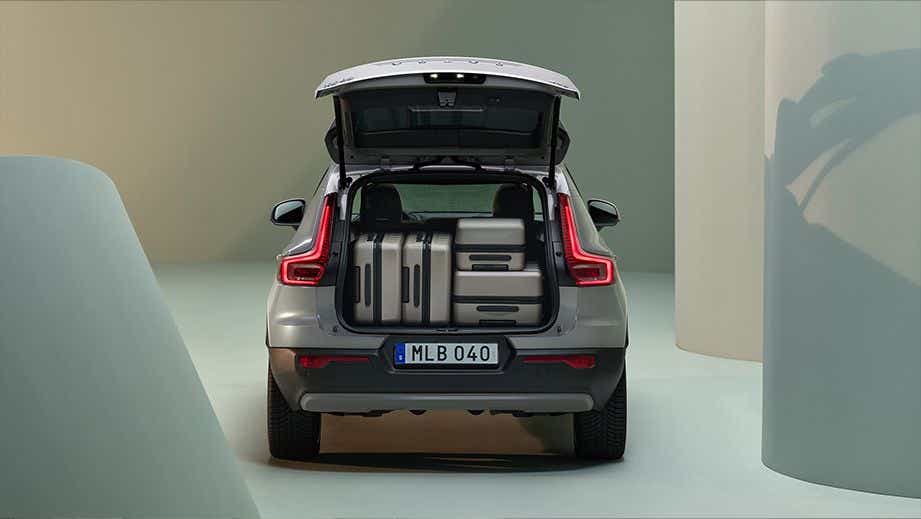 Rear view with open trunk of a Volvo XC40 showing luggage