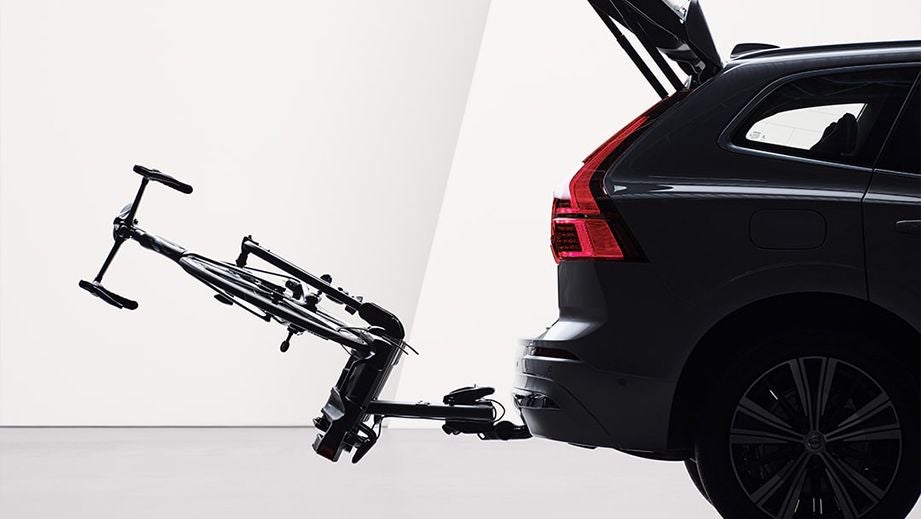 rear view of a Volvo XC60 with open tailgate and a bike rack attached
