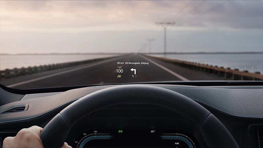Interior view with steering wheel and HUD display of a Volvo XC90 2022-2024