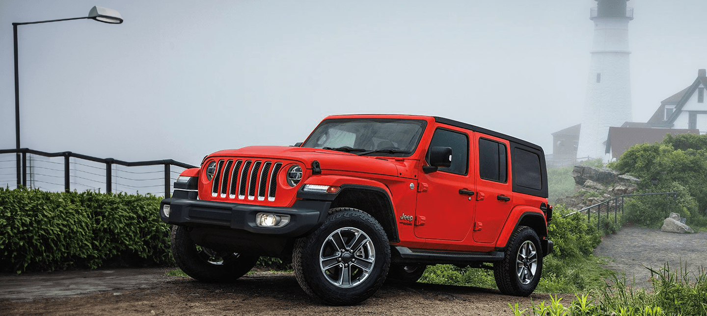 front three-quarter view of a Firecracker Red Jeep Wrangler 2021-2023