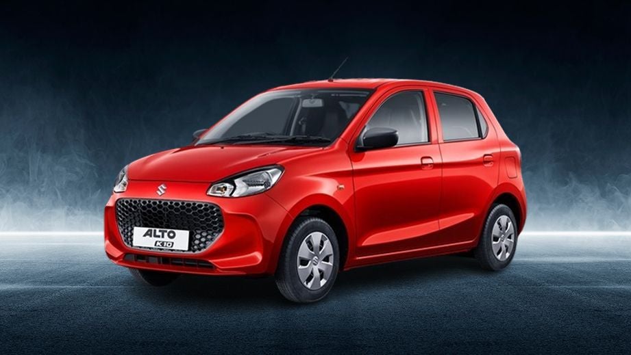 Front three-quarter view of a Metallic Sizzling Red Maruti Suzuki Alto K10