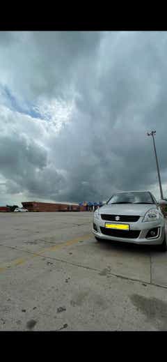 front view of a Splendid Silver Maruti Suzuki Swift
