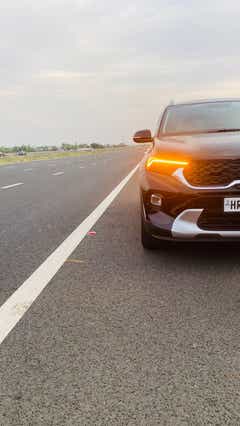 Front view of a Kia Sonet on a highway