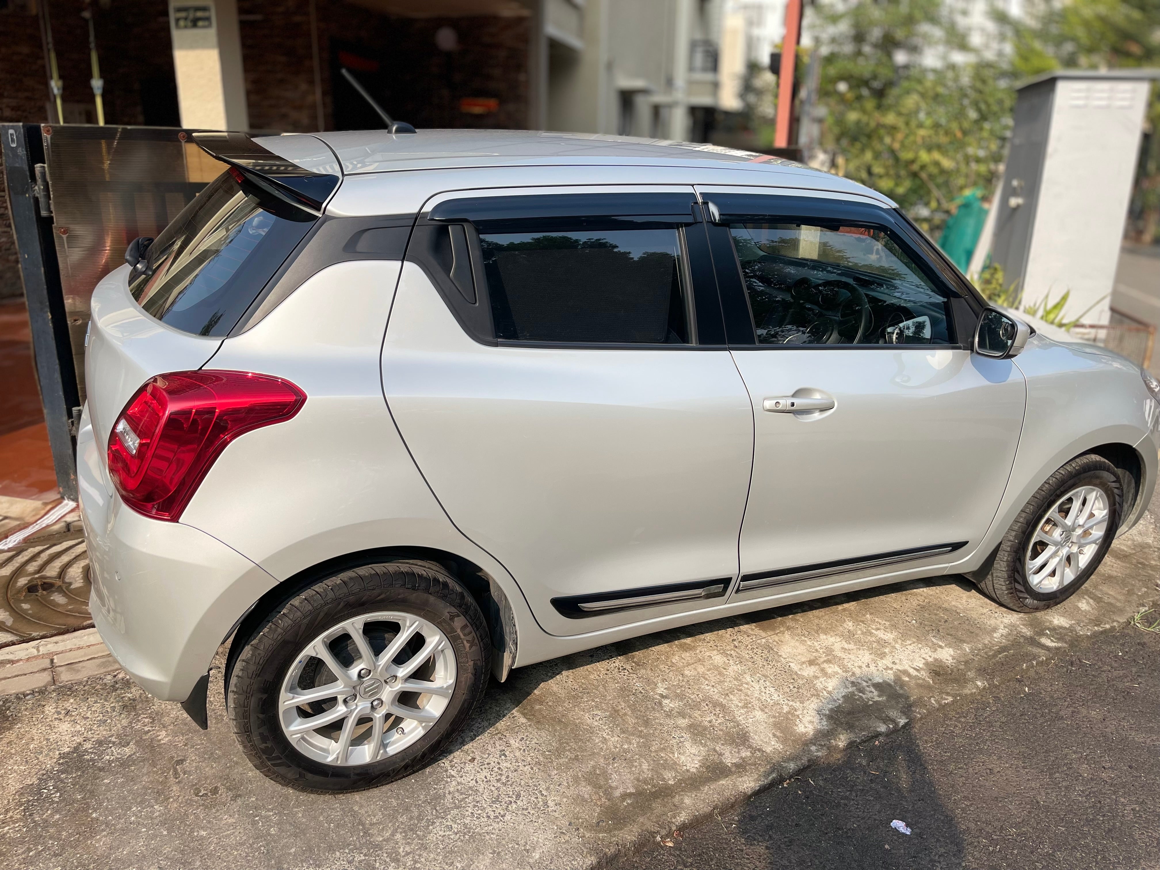 side view of a Maruti Suzuki Swift 2021 - 2023