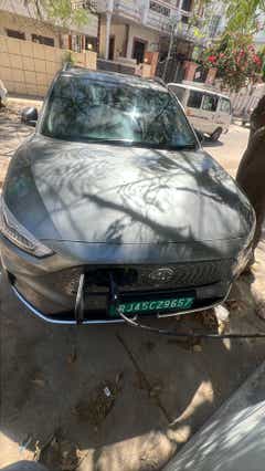 front view of a MG ZS EV charging on street