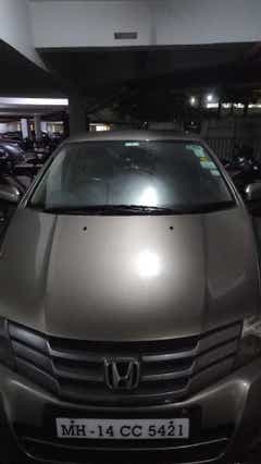 Front view of a Honda City parked in a residential area