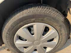Front wheel close-up of a Maruti Suzuki Dzire Tour
