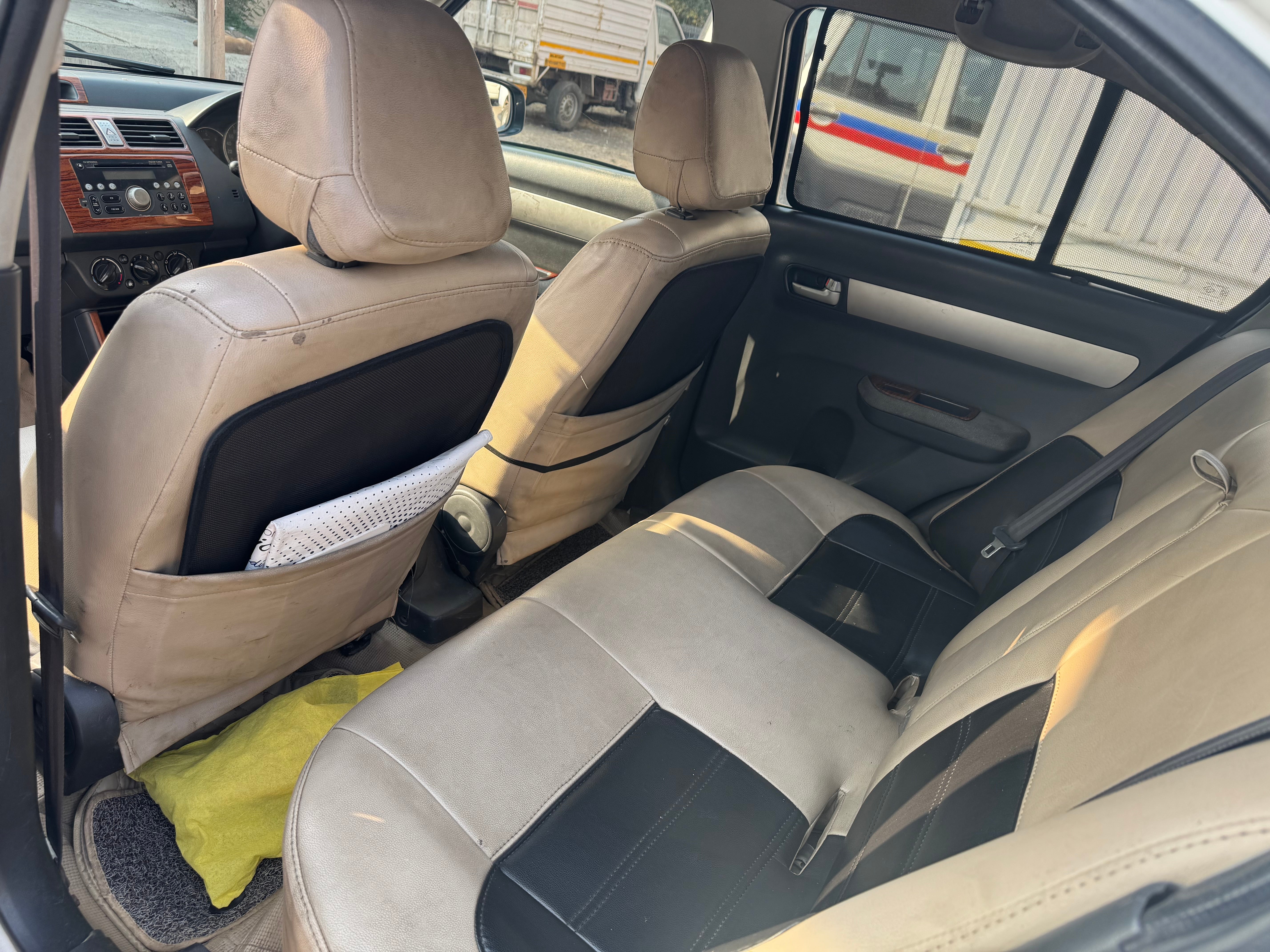 Rear seat and interior view of a Maruti Suzuki Dzire Tour