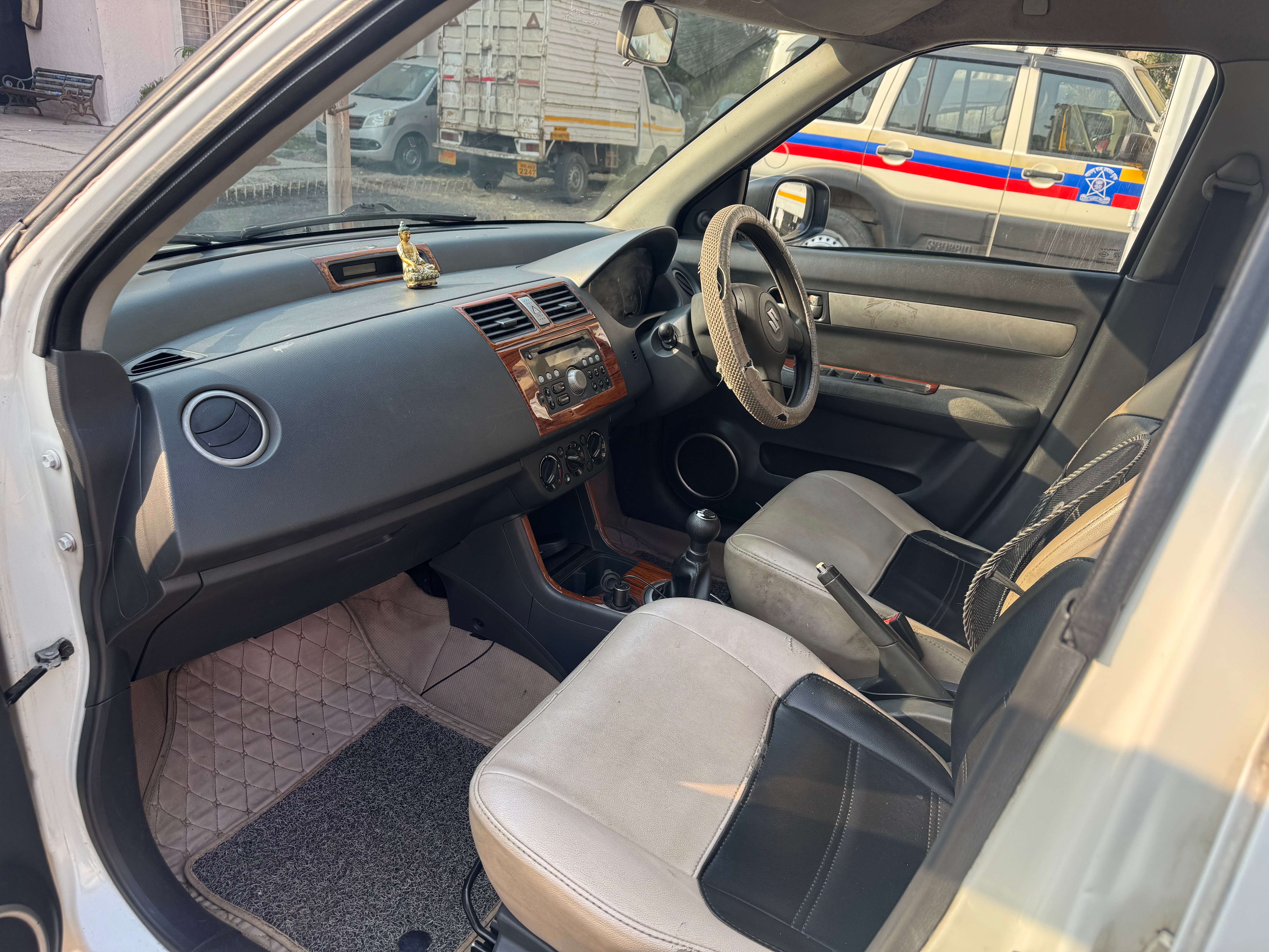interior dashboard view of a Maruti Suzuki Dzire Tour