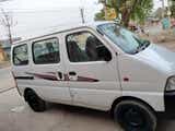 side view of a Solid White Maruti Suzuki Eeco