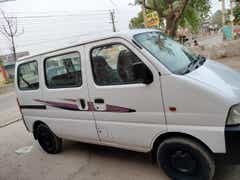 side view of a Solid White Maruti Suzuki Eeco