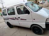 side view of a Solid White Maruti Suzuki Eeco