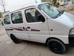 side view of a Solid White Maruti Suzuki Eeco